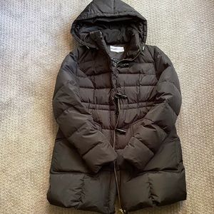 Maternity black winter coat with adjustable waist.